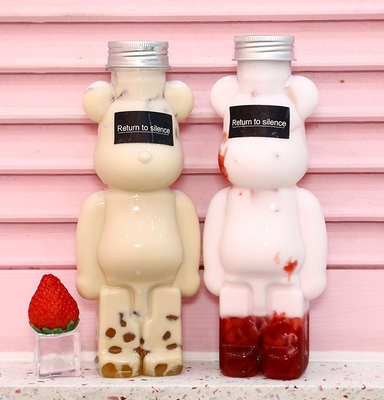 Moderne bottiglie di tè al latte con maniglia di plastica per imballaggio