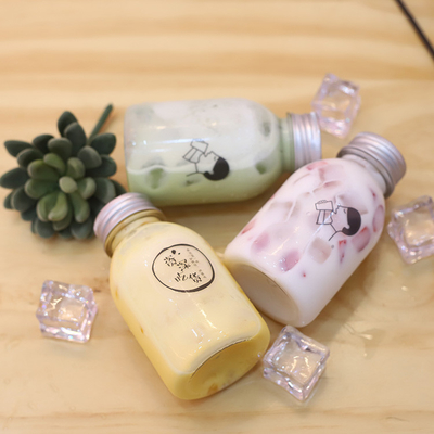 Bottiglie di tè di latte di plastica con maniglia per bere con materiale ed efficienza