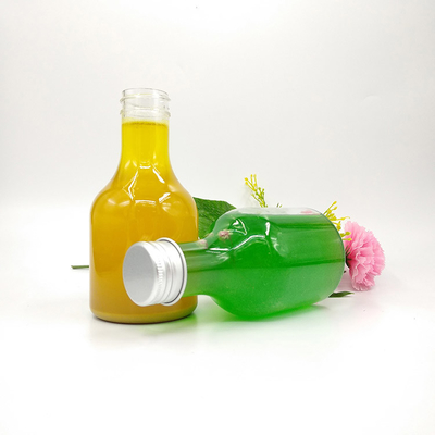 Bottiglie rotonde e quadrate di tè al latte per acqua da tè al succo