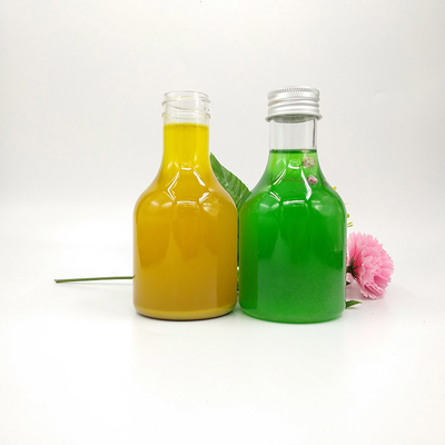 Bottiglie rotonde e quadrate di tè al latte per acqua da tè al succo