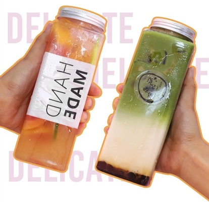 Moderne bottiglie a prova di perdite quadrate e rotonde di succo di tè al latte con manico