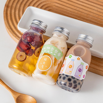 Bottiglie di succo di plastica a prova di perdite quadrate e rotonde con coperchio