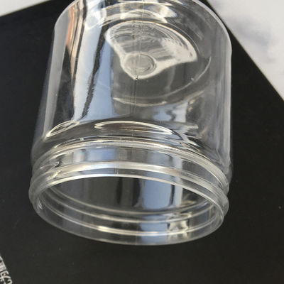 Bottiglia di plastica trasparente all'ingrosso economica con coperchio, vasetti a forma di vaso di plastica, bottiglia di plastica per scrub con fornitura di fabbrica