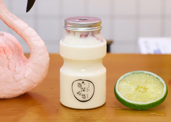 Bottiglia di plastica vuota dell'animale domestico del tè del latte della copertura del foro dello SGS con i cappucci 350ML 500ML 700ML