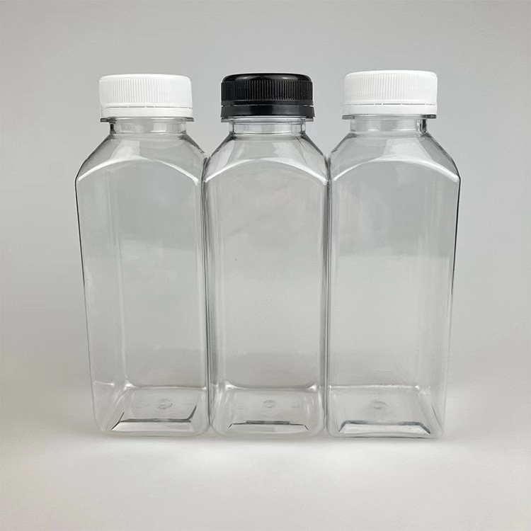 Supporto personalizzato Diverse dimensioni Chiara bottiglia di succo di plastica quadrata per animali domestici con tappi bianchi e neri